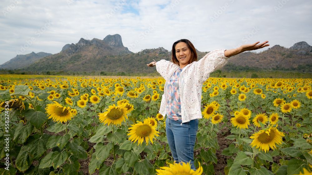 Portrait of Asia women traveling in the sunflowers field Portrait of Asia women traveling in the sunflowers field