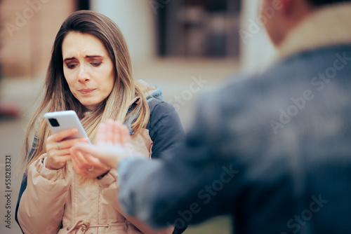 Tableau sur toile Jealous Woman Checking the Phone of Her Boyfriend Invading Privacy