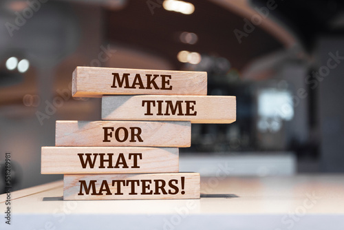 Wooden blocks with words 'Make time for what matters!'.