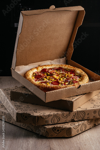 pizza from a cardboard box for delivery
