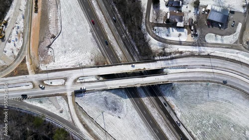 highway exist in winter with snow, Ariel drone shot, freeway exit covered with with snow. Highway in winter. photo