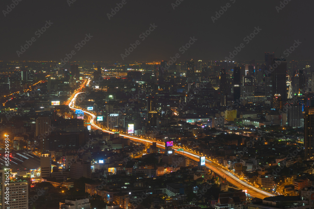 Aerial view of Bangkok Downtown Skyline, Thailand. Financial district and business centers in smart urban city in Asia. Skyscraper and high-rise buildings at night. Aerial view of Bangkok Downtown Skyline, Thailand. Financial district and business centers in smart urban city in Asia. Skyscraper and high-rise buildings at night.