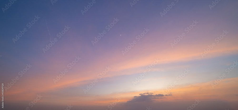 Sunset sky. Abstract nature background. Dramatic blue with orange colorful clouds in twilight time. Sunset sky. Abstract nature background. Dramatic blue with orange colorful clouds in twilight time.