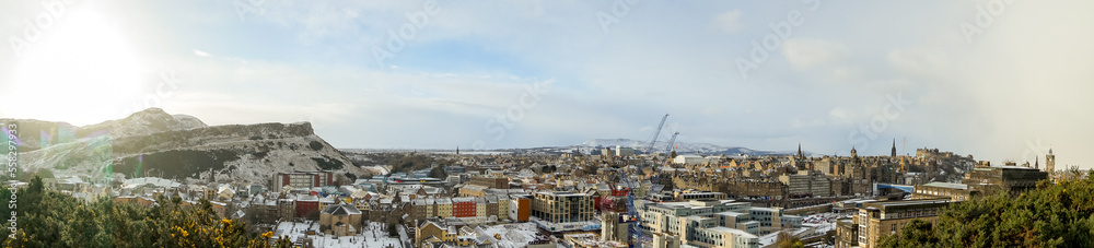 Panoramic cityscape view of Edinburgh old towns from Calton Hill with numerous monuments and buildings around during winter snow at Edinburgh , Scotland : 28 February 2018