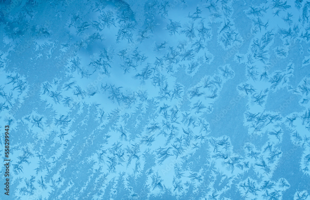 frost crystal on window glass in winter season frost crystal on window glass in winter season