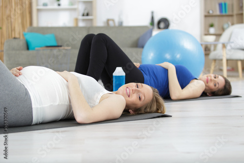 pregnant women working out with a pilates ball