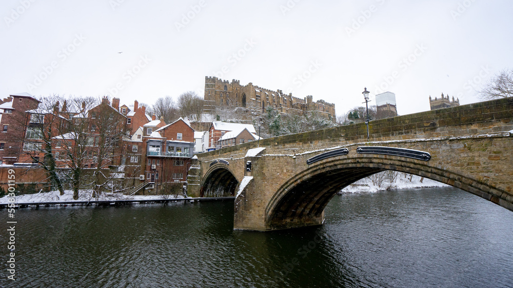 Beautiful Framwellgate Bridge over the River Wear with city view and Durham Cathedral during winter snow morning in Durham , United Kingdom : 1 March 2018
