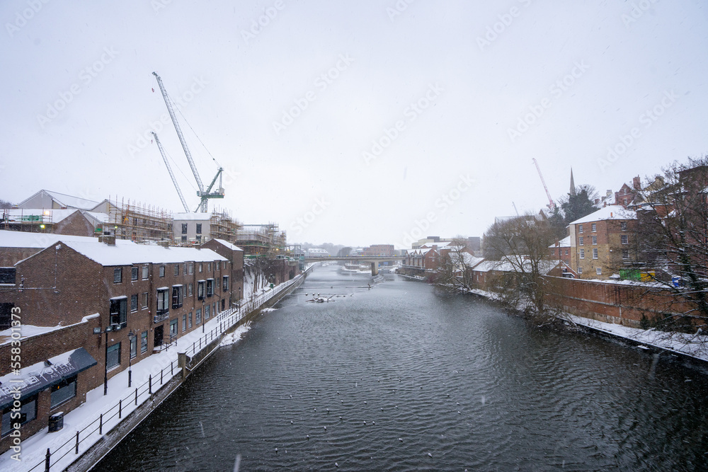 Beautiful city view from Framwellgate Bridge over the River Wear during winter snow morning in Durham , United Kingdom : 1 March 2018