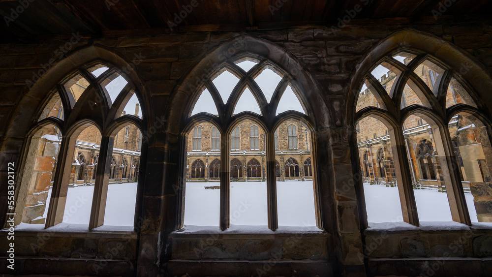 Durham Cathedral Cloister and Path , Unesco Historic Gothic and Romanesque church during winter snow morning in Durham , United Kingdom : 1 March 2018