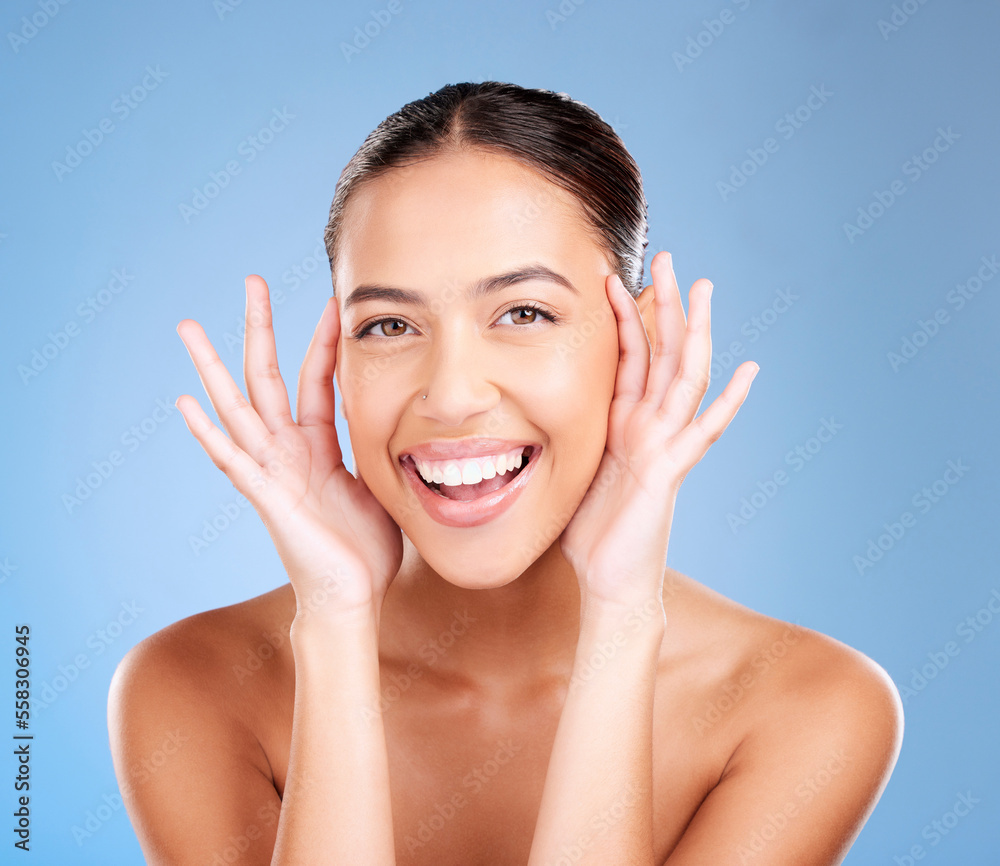 Woman, skincare and studio portrait with smile, happy and natural glow from cosmetics, self care or hands. Model, cosmetic beauty and self love with makeup aesthetic, shine or face by blue background Woman, skincare and studio portrait with smile, happy and natural glow from cosmetics, self care or hands. Model, cosmetic beauty and self love with makeup aesthetic, shine or face by blue background