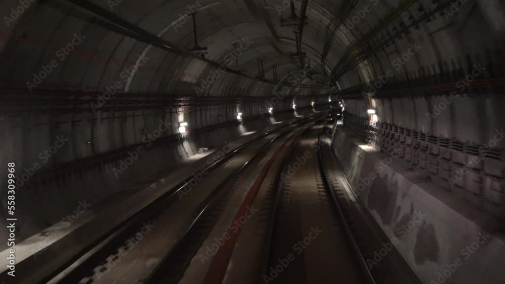 Moving through an underground public transit tunnel. Moving through an underground public transit tunnel.