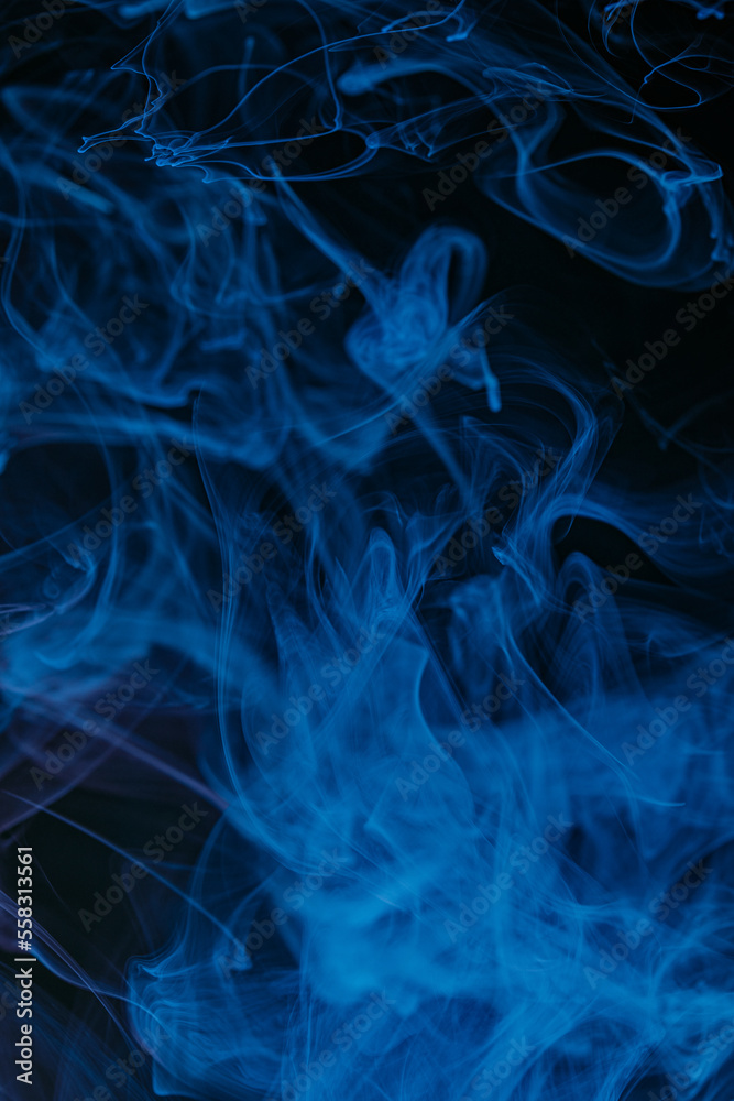 Abstract swirling smoke texture on black background