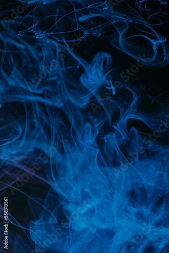 Abstract swirling smoke texture on black background