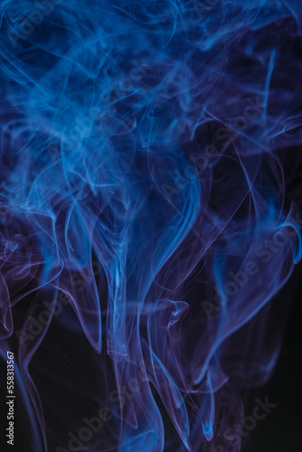Abstract swirling smoke texture on black background