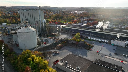 Aerial of factory buildings in USA during autumn fall foliage season. Manufacturing in America theme. photo