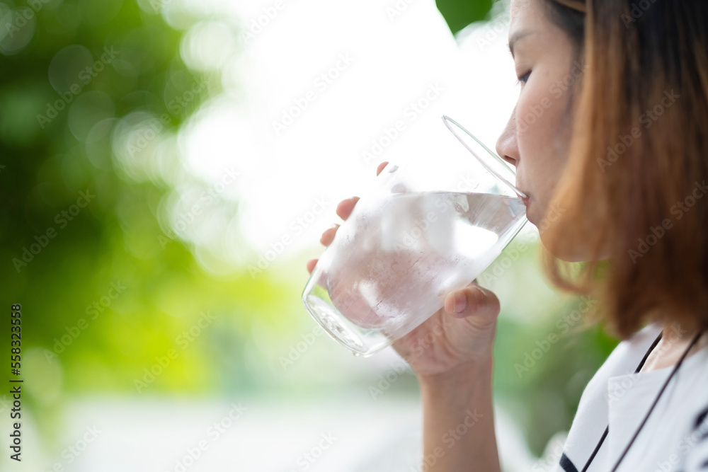 closeup hand drinking fresh water, healthcare concept closeup hand drinking fresh water, healthcare concept