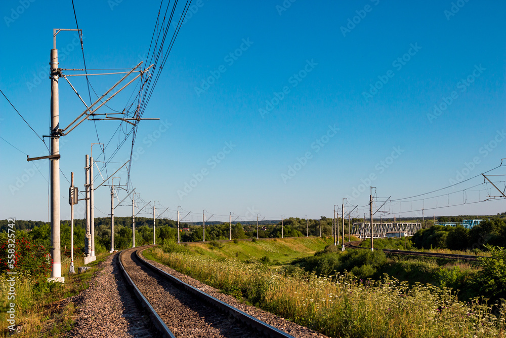 Scenic view of railway tracks turning right in the countryside Scenic view of railway tracks turning right in the countryside