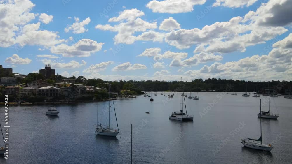 Drone shot over the top anchored boats on a calm day in a harbour Drone shot over the top anchored boats on a calm day in a harbour