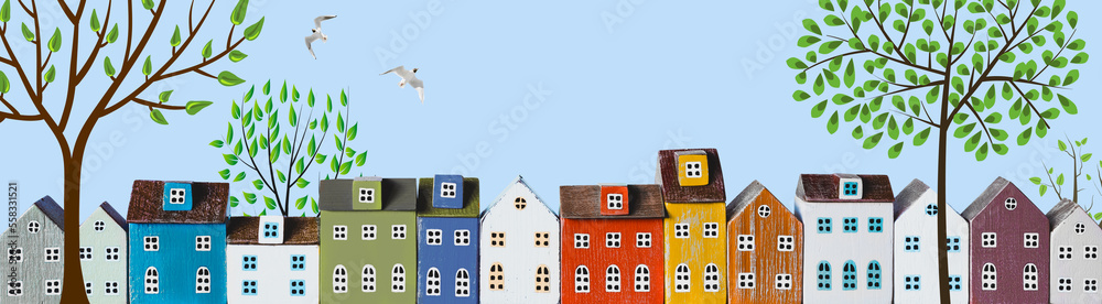 Row of wooden miniature colorful houses in spring town - obrazy, fototapety, plakaty 