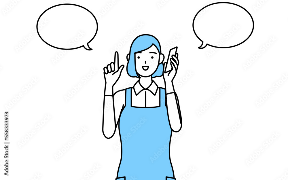 電話をしながら指さしをするエプロンを着た女性 電話をしながら指さしをするエプロンを着た女性