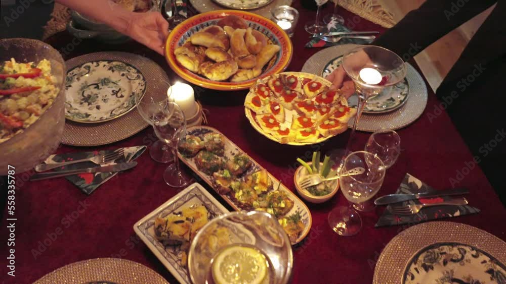 Festive table food setting on red tablecloth Festive table food setting on red tablecloth
