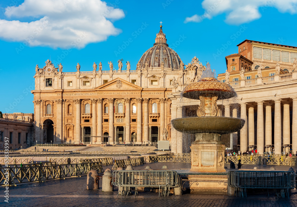 Fountain on St. Peter's square and St. Peter's basilica in Vatican, center of Rome, Italy