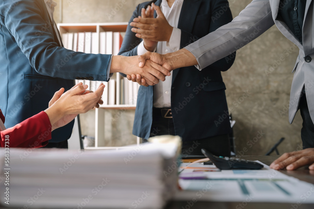 Fototapeta premium Close up two men shake hands at business meeting, office negotiations, Successful negotiations.