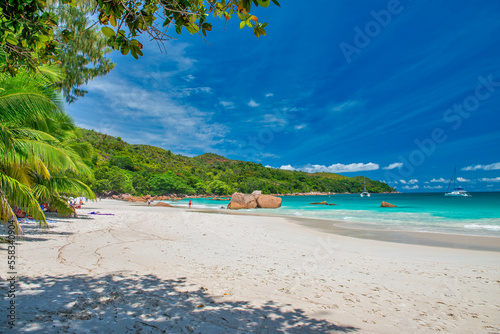 Praslin  Seychelles - September 2017  People along the beautiful beach on a sunny day