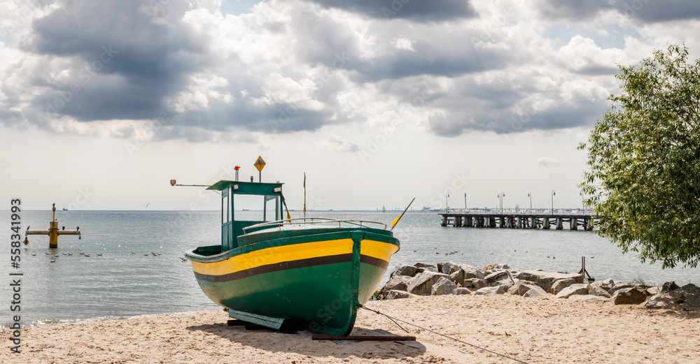 Fishing boat on beach at Baltic sea. Travel destination Gdynia Orlowo, Poland Fishing boat on beach at Baltic sea. Travel destination Gdynia Orlowo, Poland