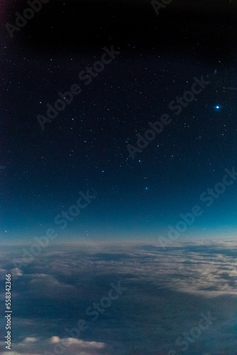 Stars and iluminated city from plane at night © Andreas