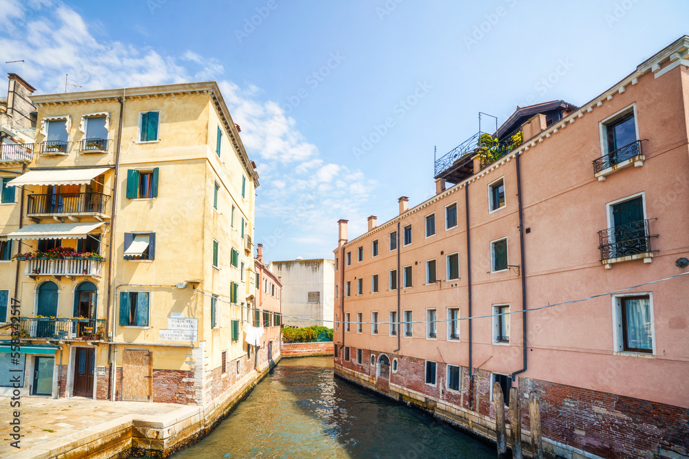 Venice city scene with a small canal