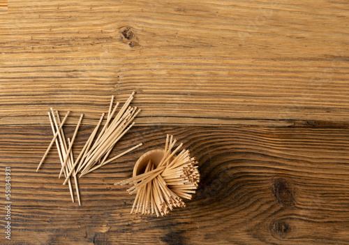 Wooden Toothpicks on Wood Background with Copy Space, Flat Lay Tooth Picks, Toothpicks Top View Mockup