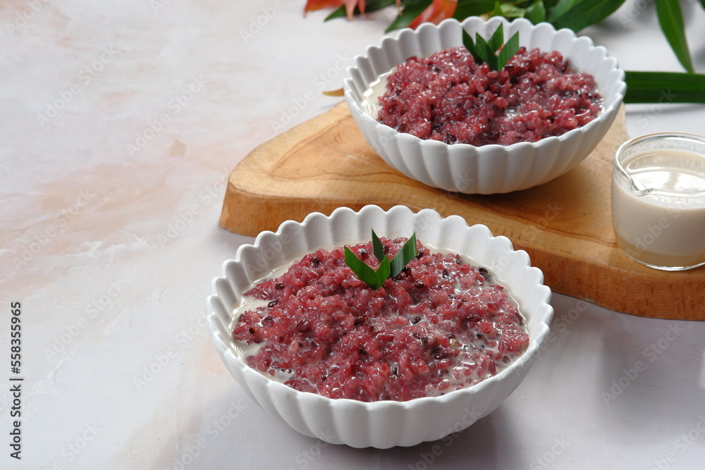 Bubur Ketan Hitam, Indonesian dessert. Black glutinous rice porridge with coconut milk or black sticky rice pudding (thai dessert ) Bubur Ketan Hitam, Indonesian dessert. Black glutinous rice porridge with coconut milk or black sticky rice pudding (thai dessert )