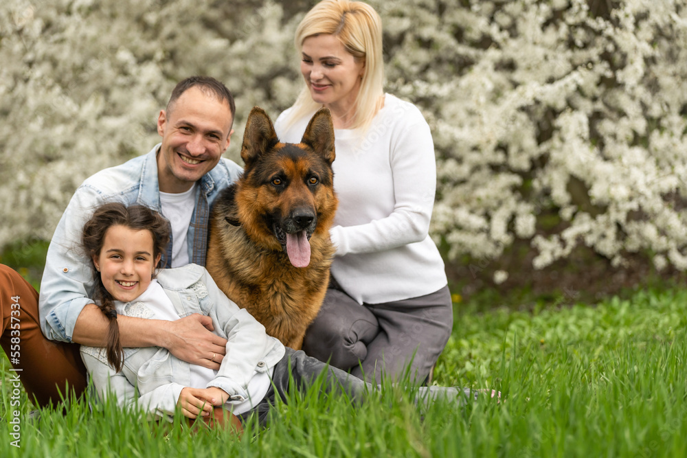 Young family with children and with dog having fun in nature Young family with children and with dog having fun in nature