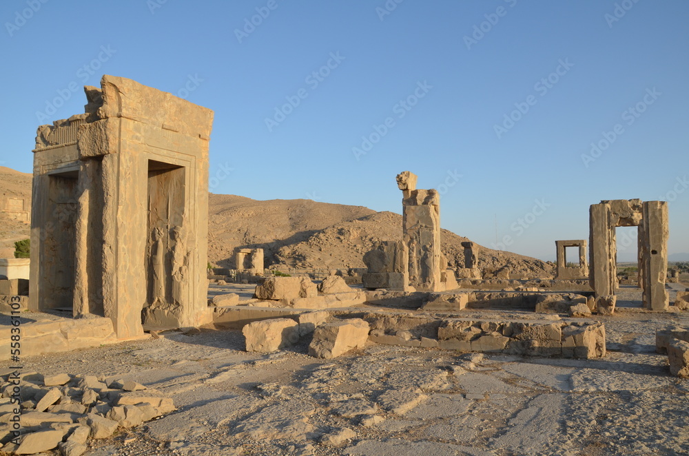 ruins and columns of Persepolis , Iran in the evening sun