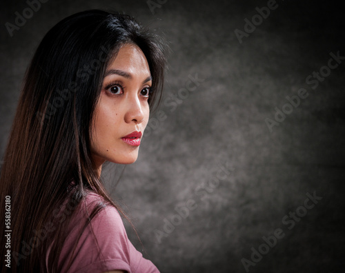 Young pretty woman in profile - portrait shot - studio photography