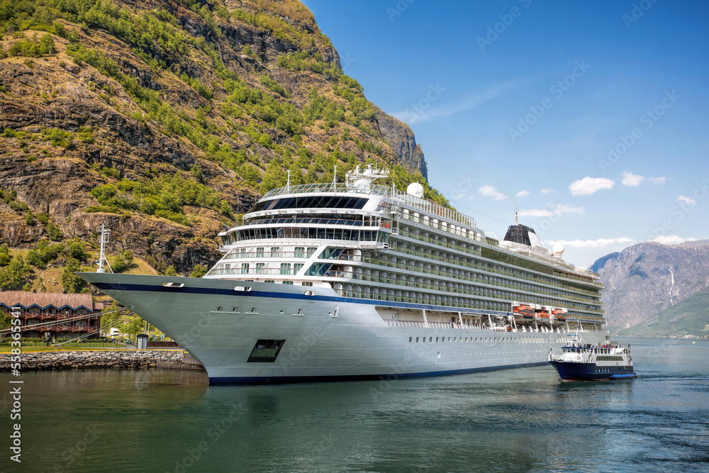 Port of Flam against fjord with luxury cruise ship in Norway