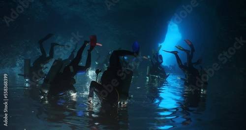 Wallpaper Mural cave diving underwater scuba divers exploring caves and having fun ocean scenery sun beams and rays background Torontodigital.ca