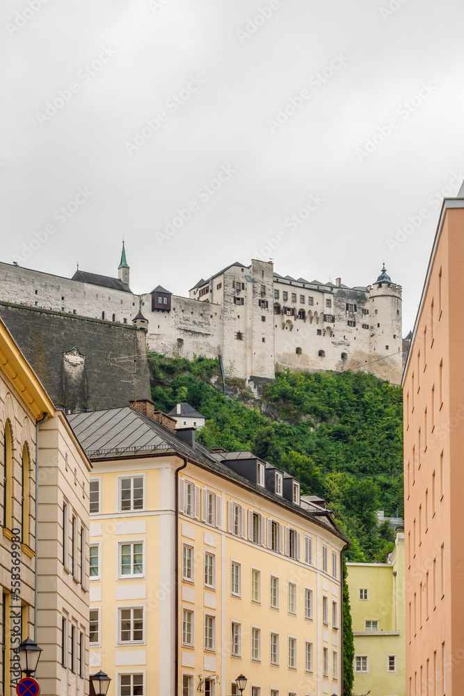 Historical buildings in the center of Salzburg and the fortress of Hohensalzburg situated on a hill above them