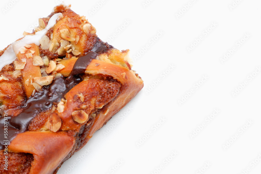 Delicious cake with peanut butter cream layer and chocolate topping. Bakery white background. Selective focus Delicious cake with peanut butter cream layer and chocolate topping. Bakery white background. Selective focus