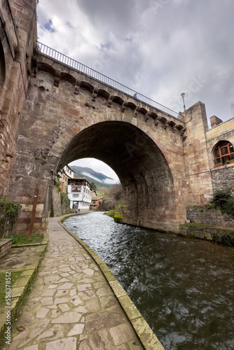 View of a medieval bridge over the river in the village of Potes in Cantabria  Spain. High quality photo