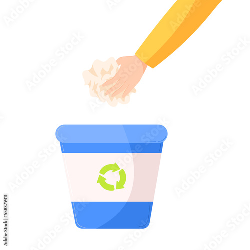 a hand putting a paper litter in a blue recycling trash can. the concept of a sorting wastes