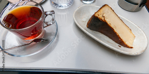 Photography Turkish Traditional Tea and Cheesecake served in a restaurant