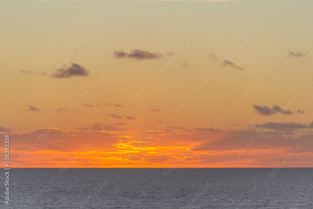 Colorful sunrise with clouds over the sea