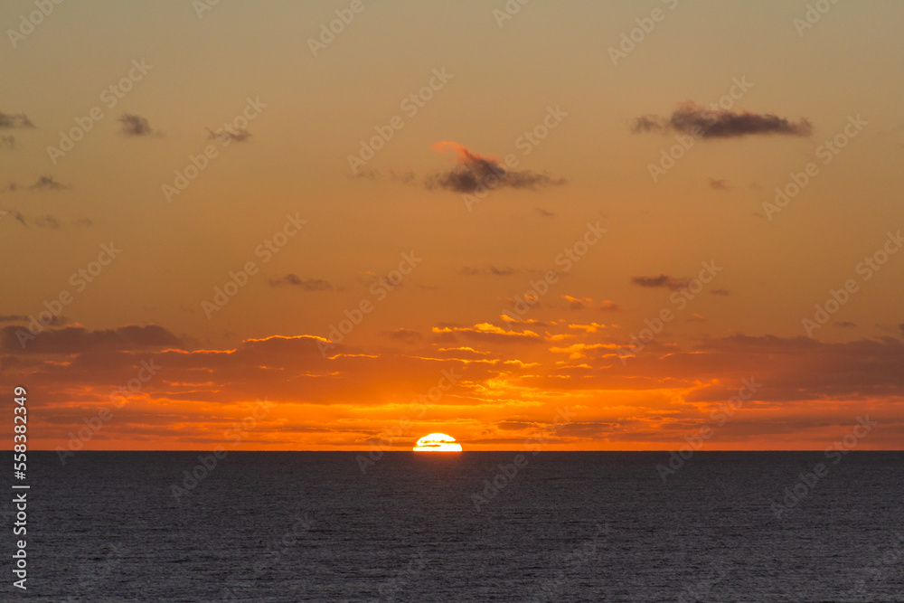 Colorful sunrise with clouds over the sea