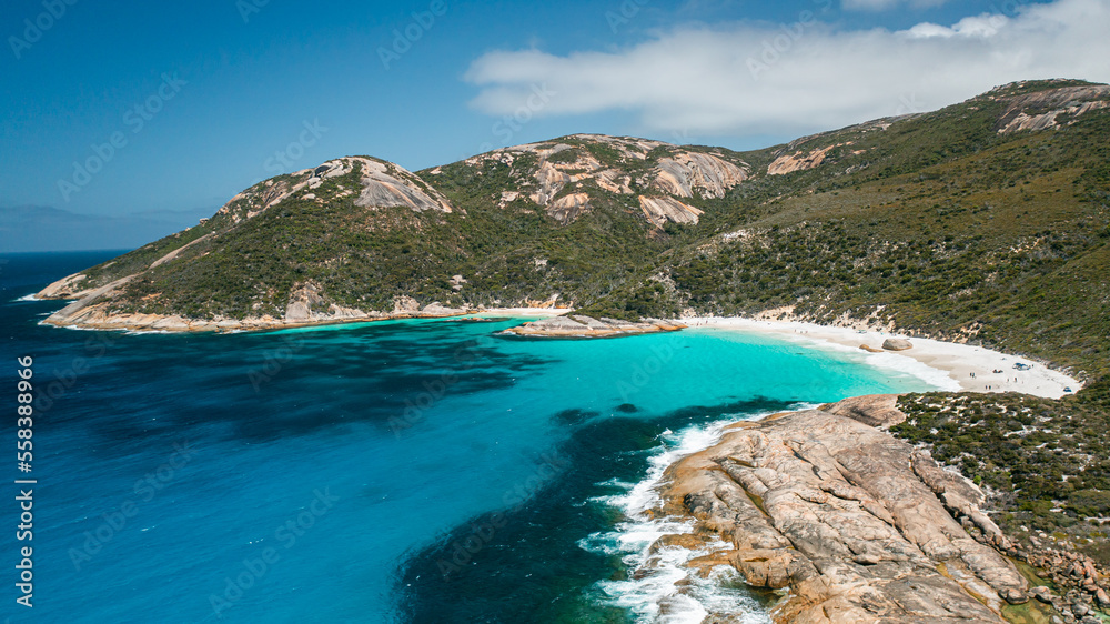 Beautiful image of turquoise colour water, little beach, and mountain range in Two Peoples Bay, Albany, Western Australia