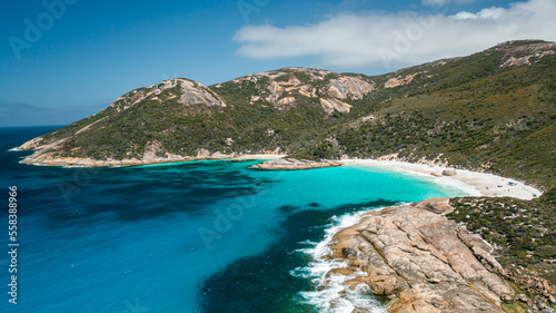 Beautiful image of turquoise colour water, little beach, and mountain range in Two Peoples Bay, Albany, Western Australia