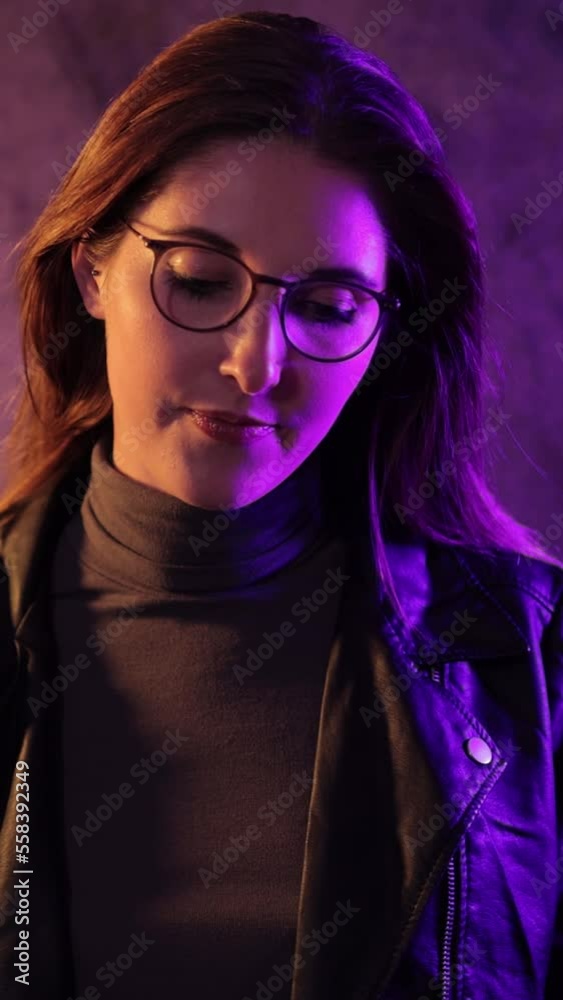 Beauty and fashion shot of a young pretty woman - slow motion shot - Vertical video Beauty and fashion shot of a young pretty woman - slow motion shot - Vertical video