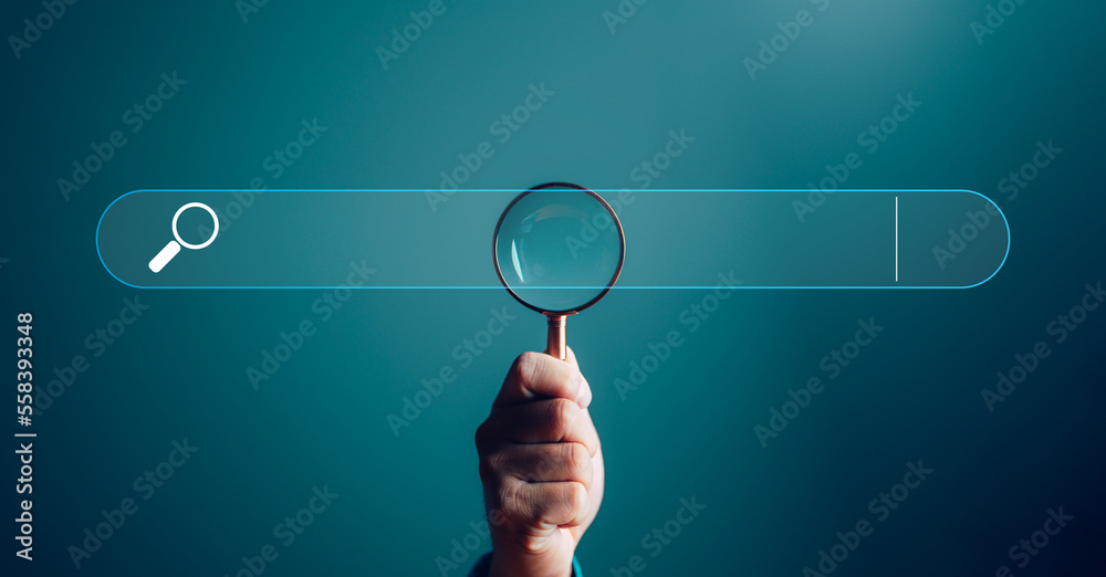 Businessman hand use magnifying glass Search On Virtual Screen Data Search Technology Search Engine Optimization. Searching for information. Using Search Console for data, info. - obrazy, fototapety, plakaty 