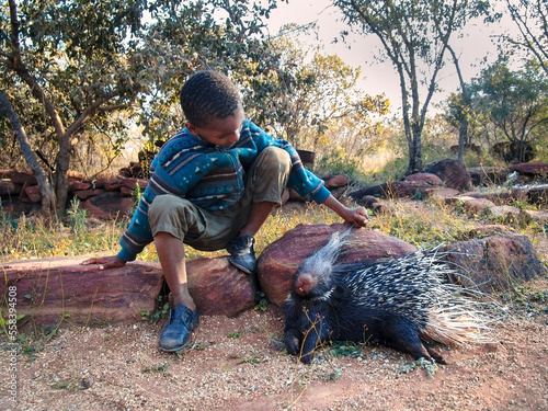 village African boy and pet photo